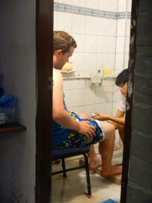Mike getting his feet scrubbed