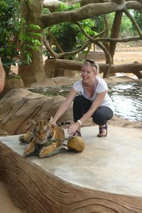 Sarah playing with the tiger cub