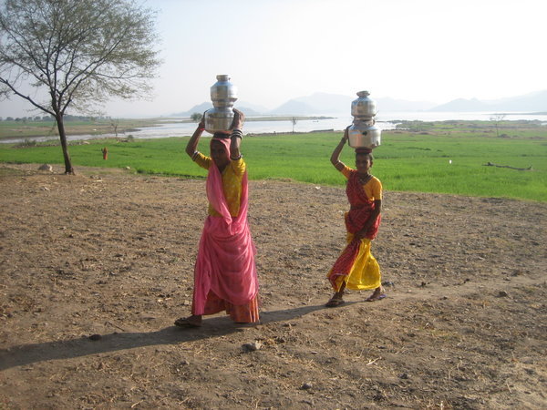women carrying water