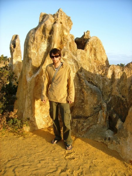 Adrian standing next to limestone giants