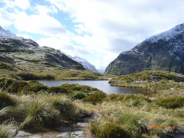 A lake at the top of MacKinnon Pass