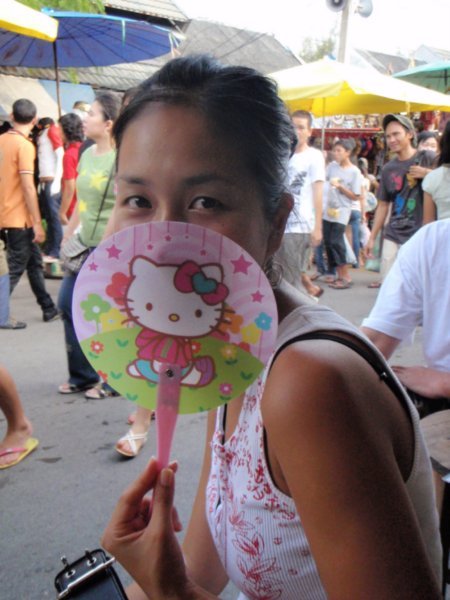 jean looking like a very typical asian with her hello kitty fan