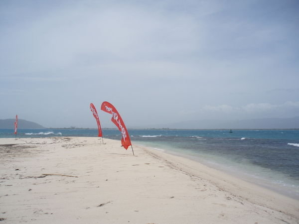 Red Stripe flags on Lime Cay
