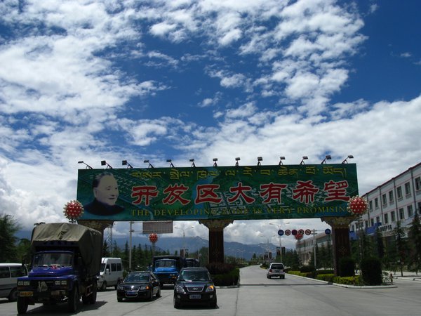 A sign in the han-chinese dominated west side of lhasa that says "the developing zone is very promising"