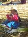 An island girl, eating reeds