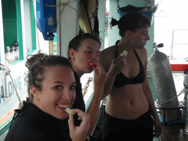 On the boat having a snack between dives