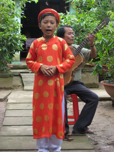 a Vietnamese singer performing for our tea inthe Mekong 