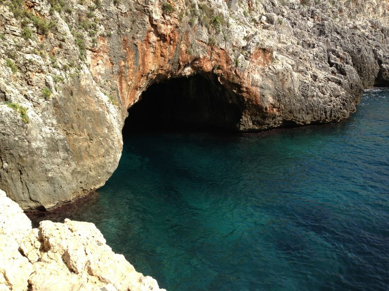 The inviting water and cave