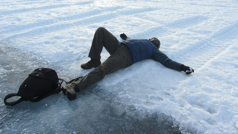 Kwesi laying down on the ice runway