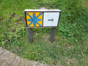 64 Camino like symbols - think they are walking tour markers