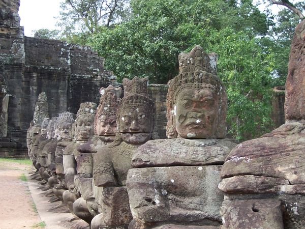 Guarding the gate at Angkor Thom