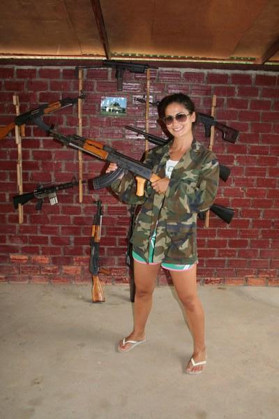 Mel models an AK 47 