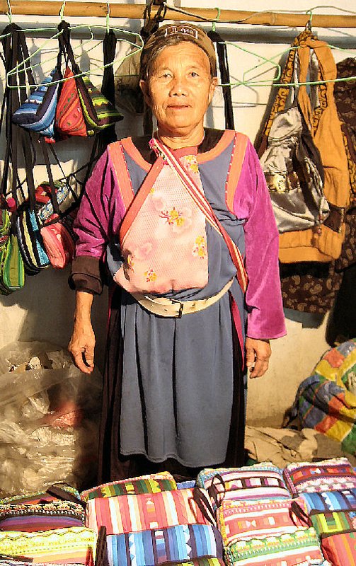 Lisu tribe member, selling her market wares in Pai, Thailand