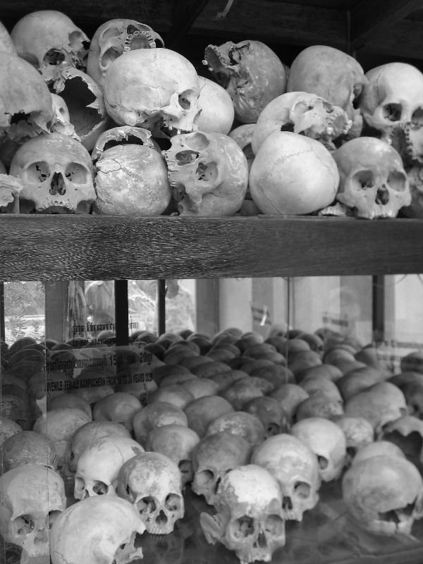 Glass stupa containing thousands of skulls, at the Killing Fields of Cheung Ek, Phnom Penh - a local lady standing next to me was sobbing and trying to touch the skulls, which was very intense
