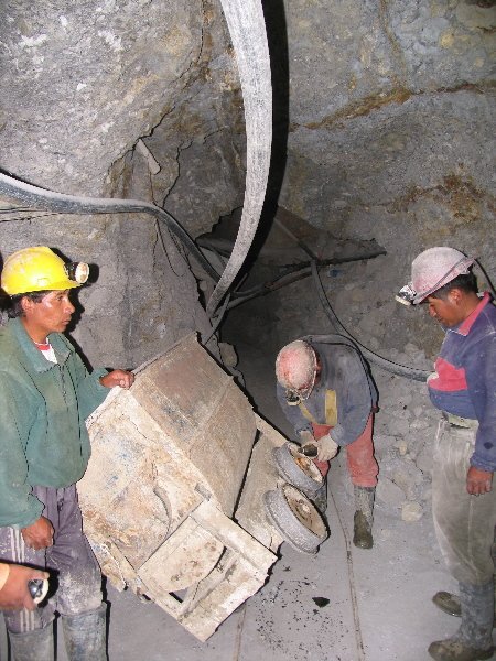 Miners working to get a cart back on track