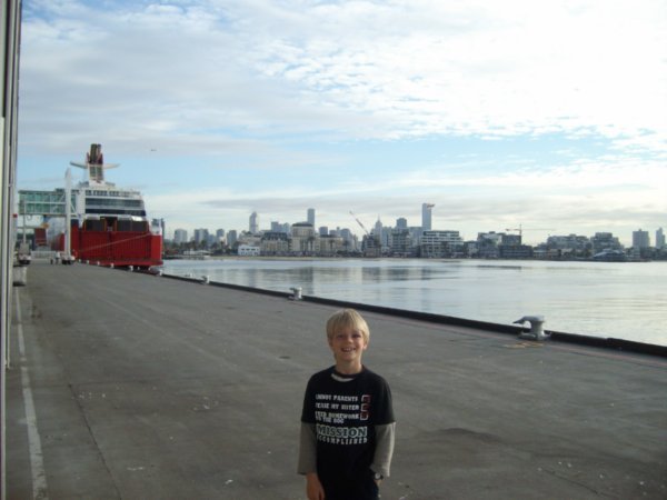Thomas in front of Spirit of Tasmania ferry