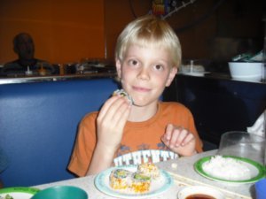 Thomas eating sushi on his 9th birthday