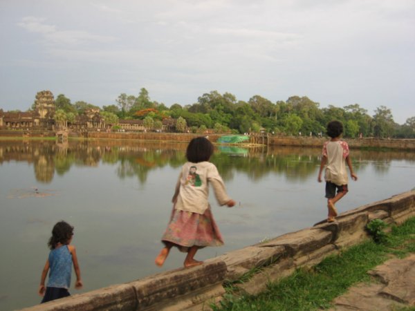 Kids playing in front of Angkor