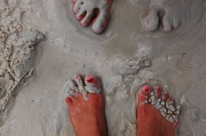 Les pieds dans le sable