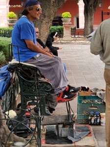 Guy hanging out with shoe shiner