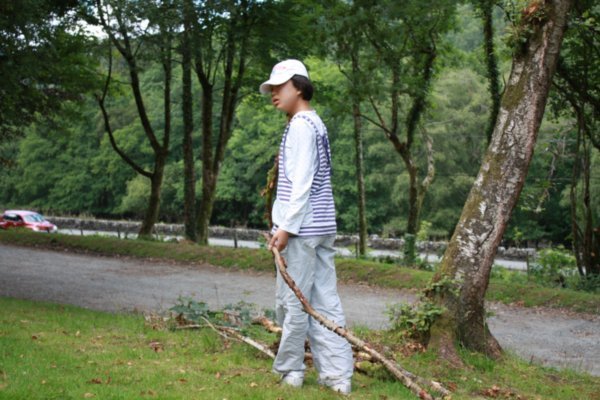 Ji Na collecting firewood