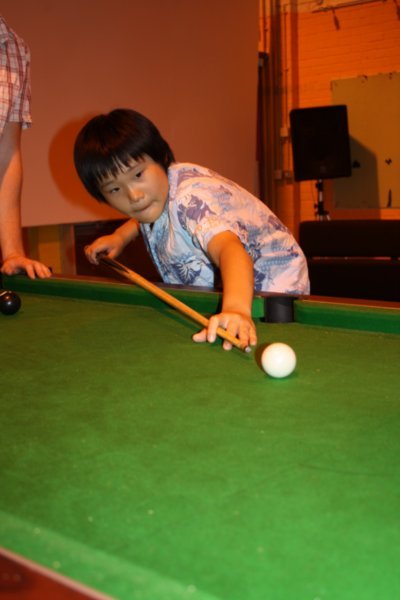 Young Kwon playing pool