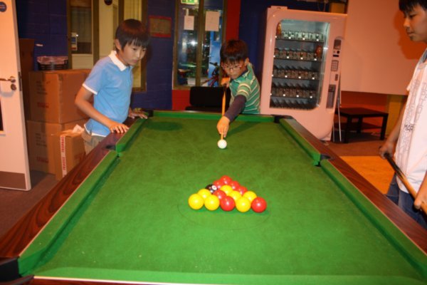 Ki Yeon and Sang Huk playing pool