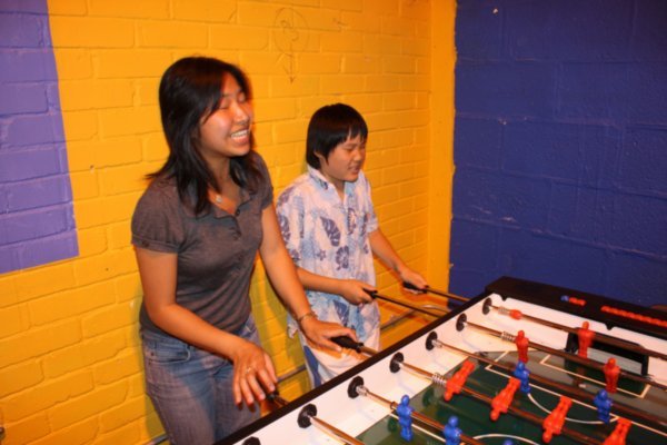 Tiem and Young Kwon playing table football