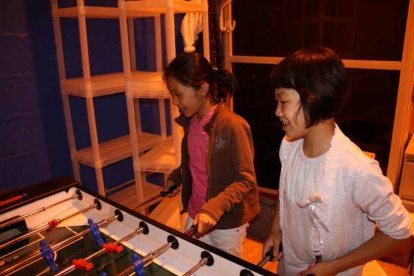 Ji Na and Yeo Myeoung playing table football