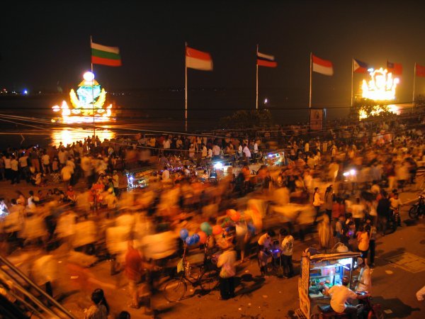 people by the pier at night