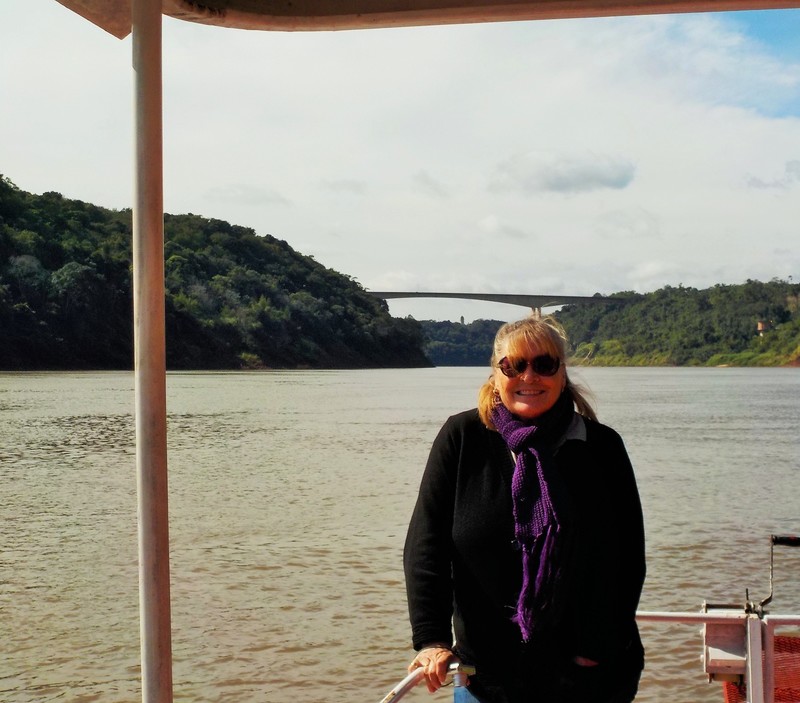 On the Rio Iguazu with the border br8dge in the background