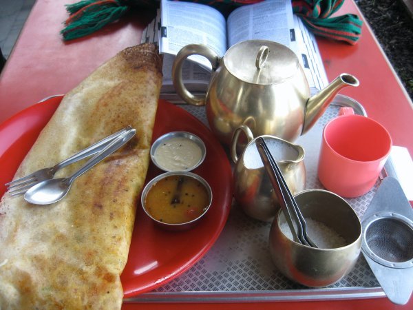 Giant dosa and pot of Darjeeling with view of the mountains for breakfast!