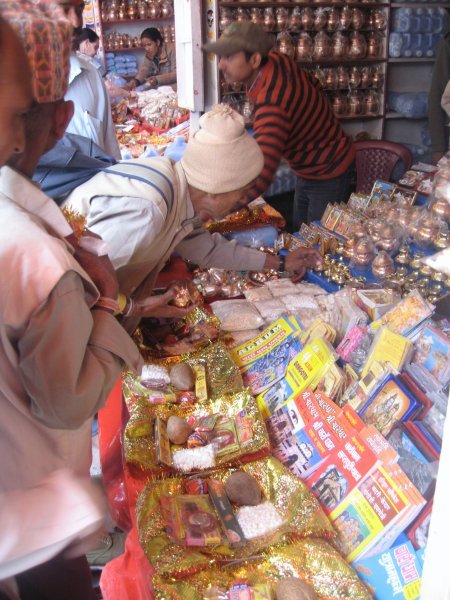 Pilgrims buying supplies for the pooja