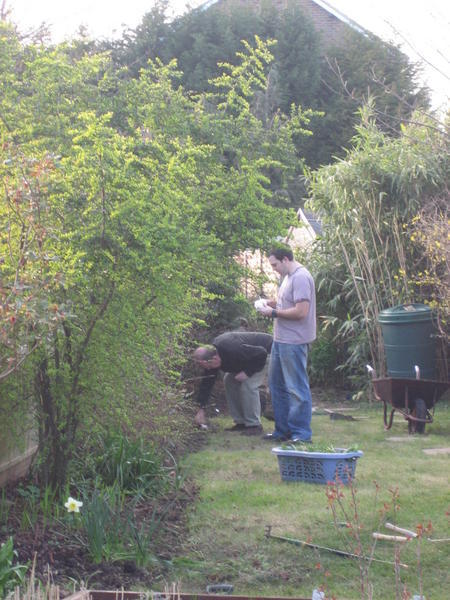 Tony and dad clearing the garden