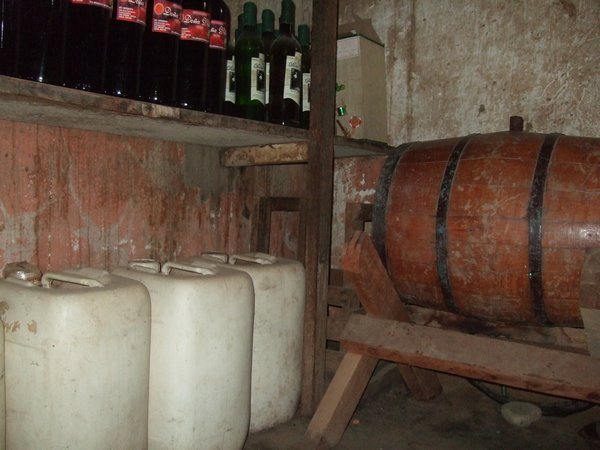 Glass bottles, wooden barrels and plastic drums...all full of wine