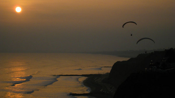 Paragliders over the Pacific