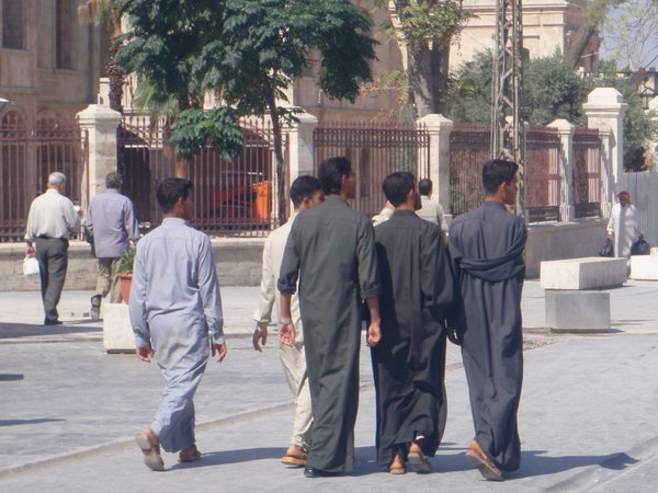 Men walking in their Gallibaya