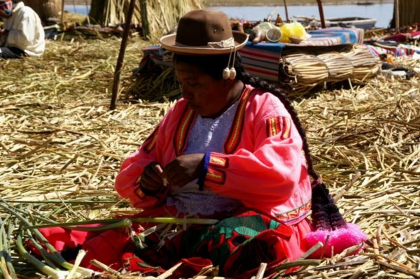 A lady weaving on the island of Uros