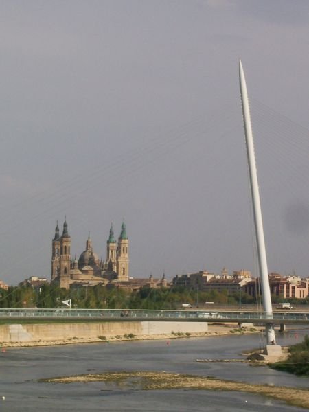 The Expo pedestrian bridge and a Zaragoza basillica. 
