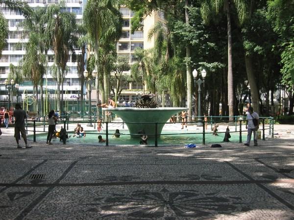 Kids playing in a fountain on a hot day