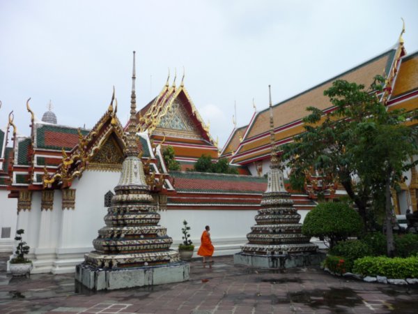Wat Pho - Monk next to a temple