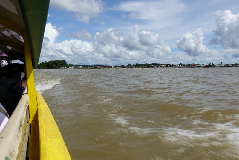 travelling across the river which forms the border between French Guina and Suriname