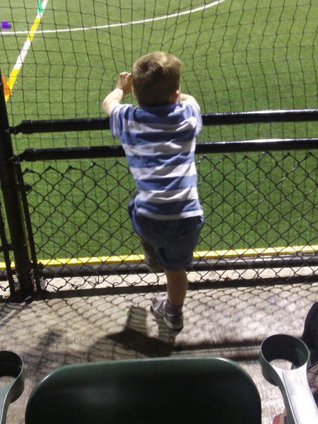 Lachlan watching James play soccer