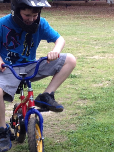 James riding Lachlan's small bike