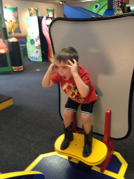 Lachlan playing a game at Chucky Cheese