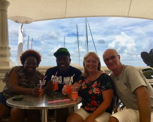 Enjoying a drink with our Jamaican friends at the Marina