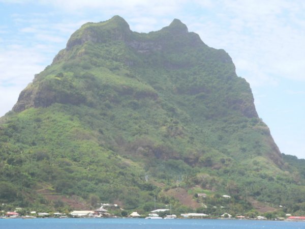 A mountain shot with houses at the base