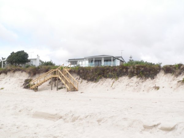 One of the pretty houses overlooking the beach at New Chums Bay