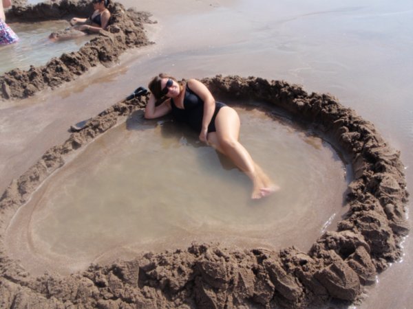 Karen enjoying Hot Water Beach