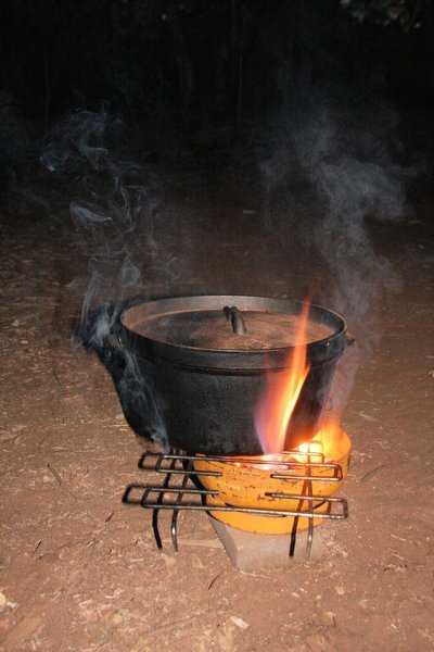 Camp oven cooking merrily away